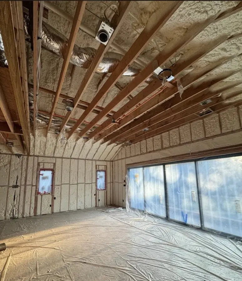 Interior walls and ceiling insulated with spray foam during new construction in Shawano